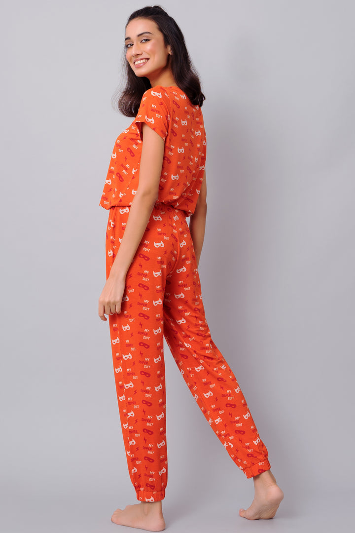 Bright orange Super Suit Top in playful print, perfect for lounging.
