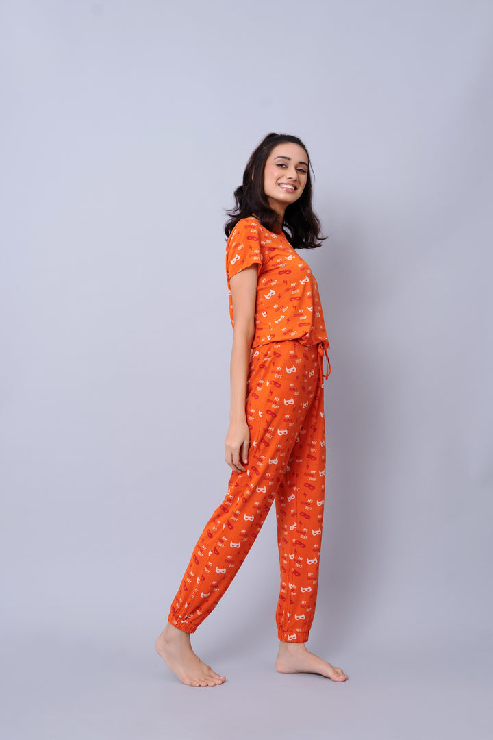 Bright orange Super Suit Top and pants set for casual wear.