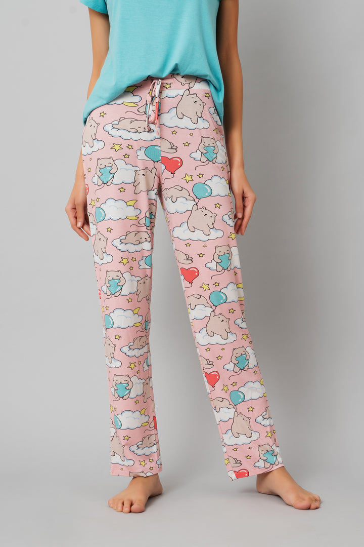 Playful pink pajama set featuring cute bear and cloud print.