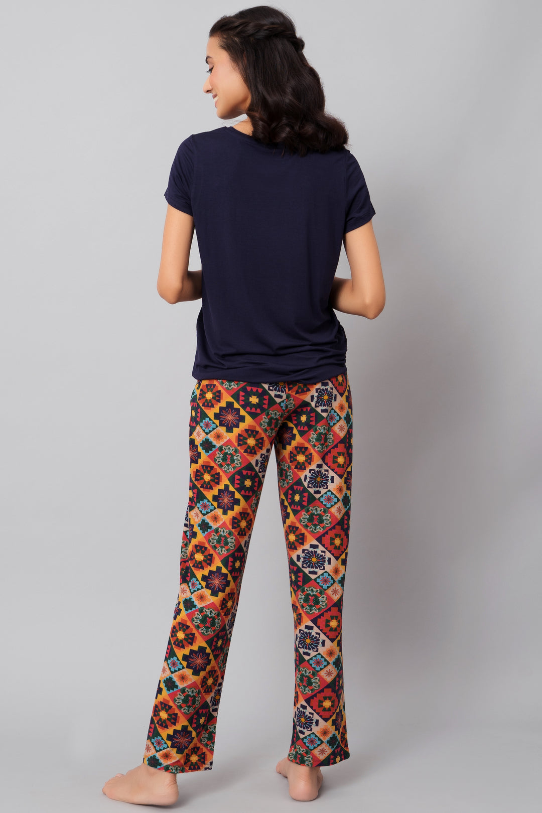 Floral Aztec pajama set featuring colorful patterned pants and navy top.