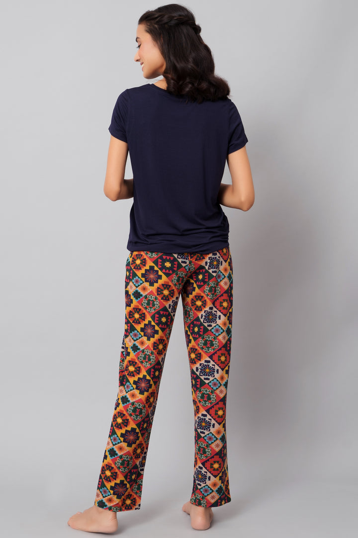 Floral Aztec pajama set featuring colorful patterned pants and navy top.