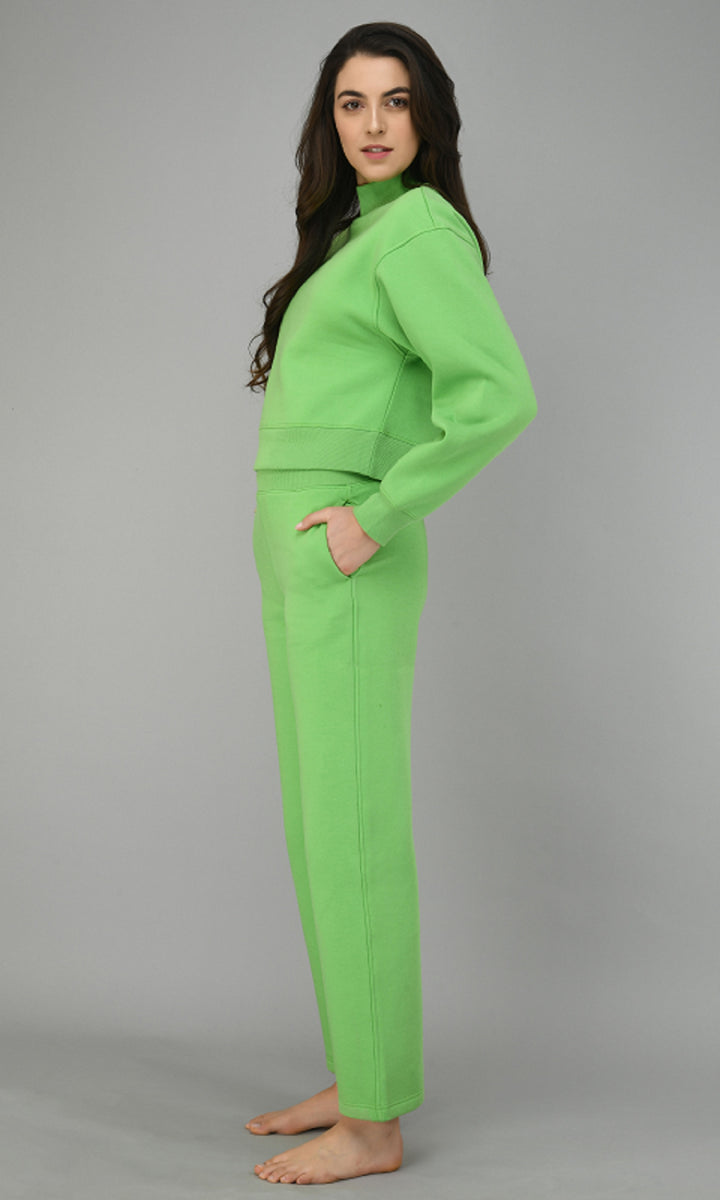Glam Green Fleece Lounge Set modeled by a woman standing sideways.