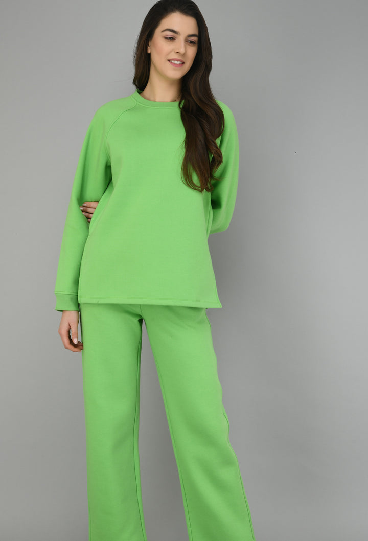Model wearing a chic Glam Green Fleece Lounge Set.