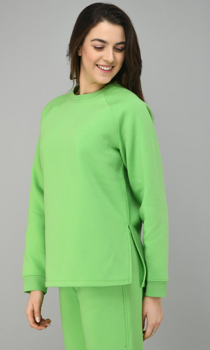 Woman wearing a glam green fleece long pullover set.
