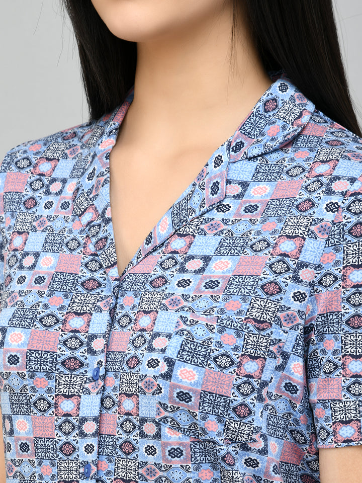 Classic mosaic button-down pajama set in vibrant blue and pink patterns.