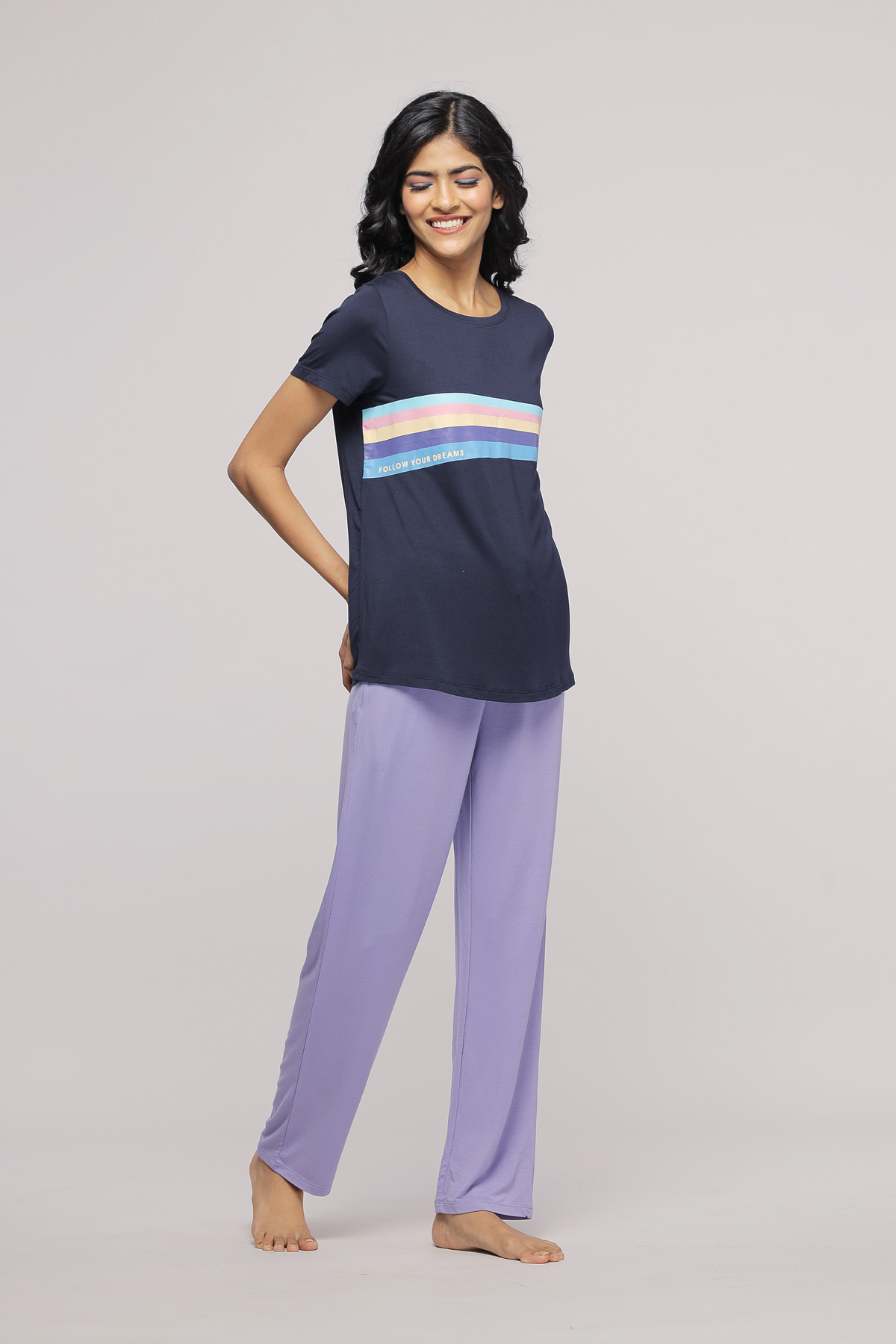 "Model wearing Follow Your Dream Top with purple pants"