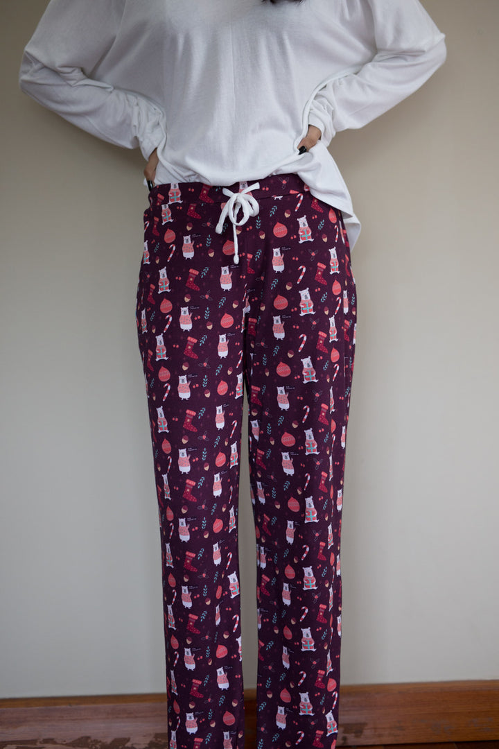 Frosty Christmas Pajama Set with festive bear and ornament design.