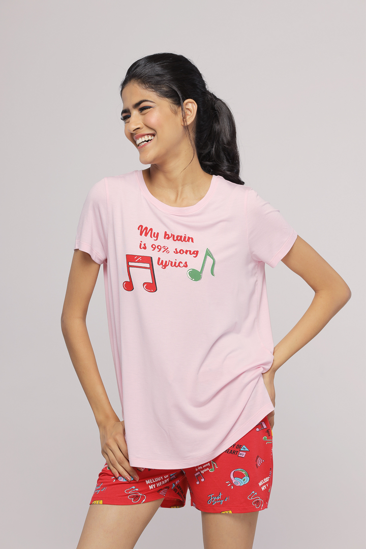 Woman wearing Music In My Heart Shorts and matching graphic t-shirt.