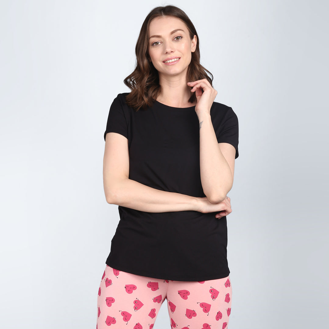 Everyday Black Pajama Set model showcasing comfortable styling and relaxation.