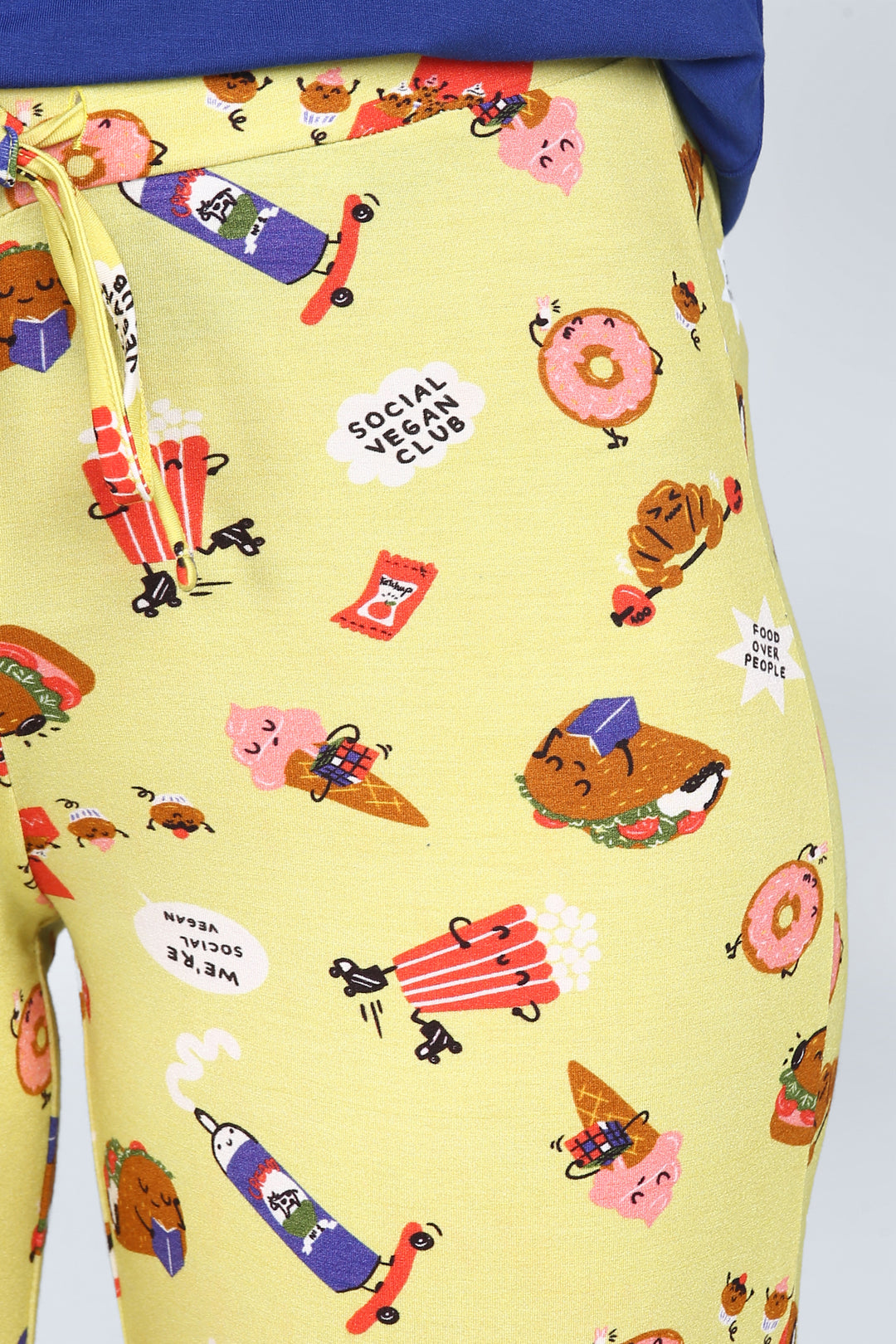 Colorful vegan-themed shorts set with playful food graphics.