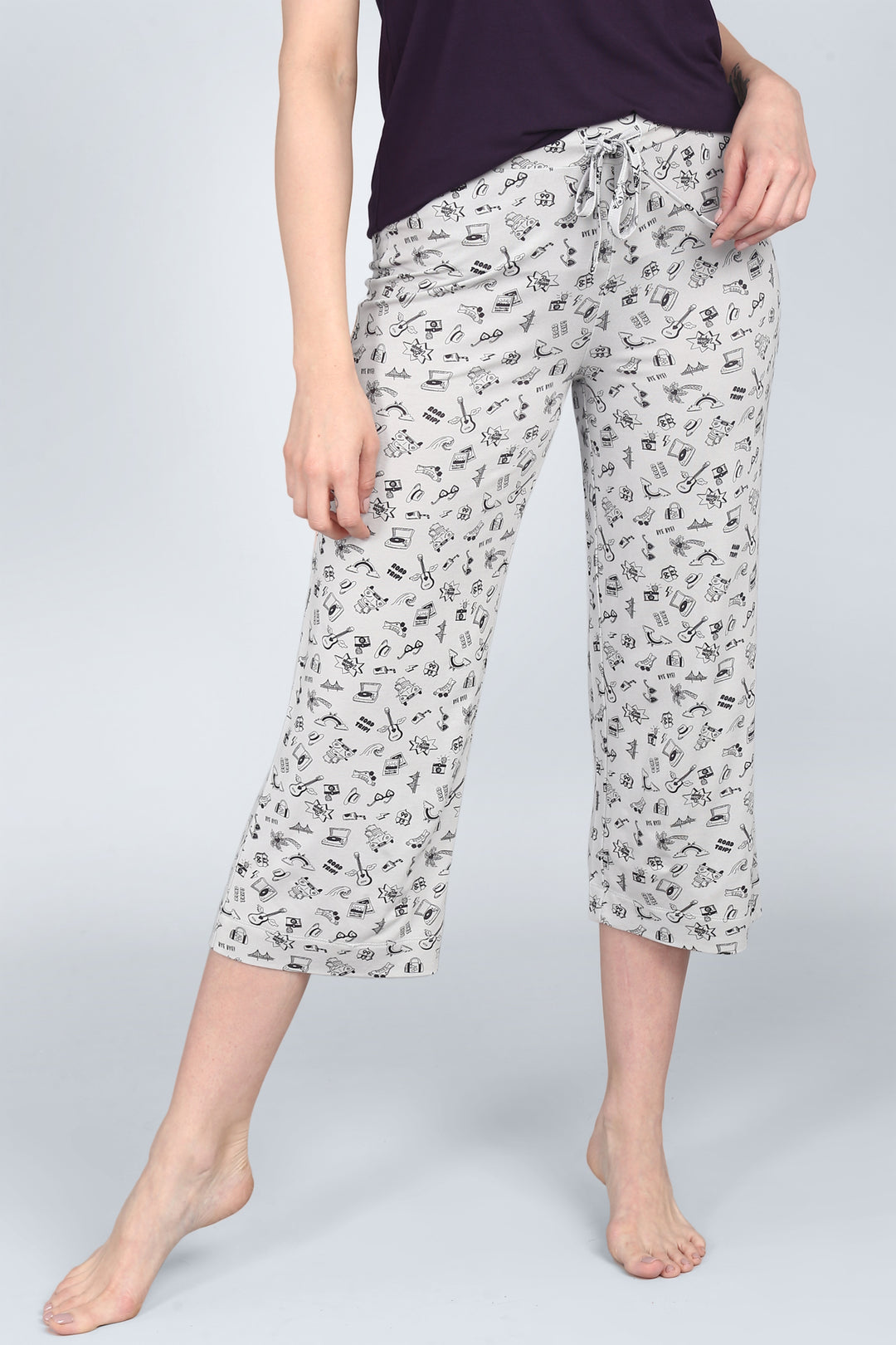 Bon Voyage Capri Set featuring playful travel-themed print pants.