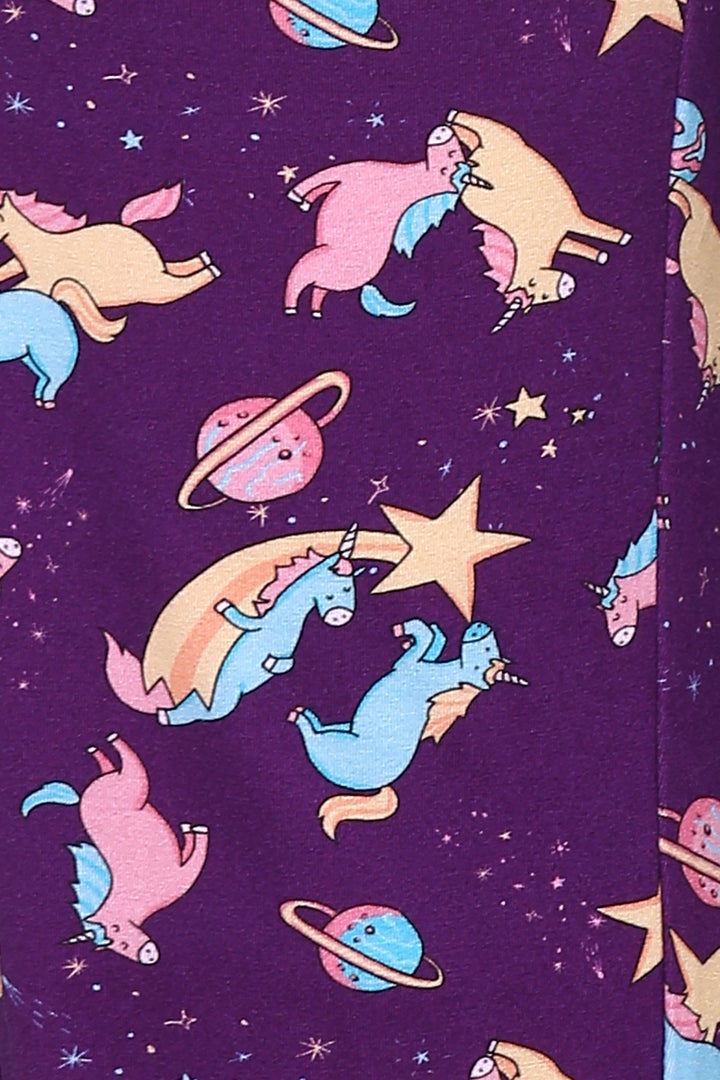 Colorful unicorns in space on a purple Capri set fabric.