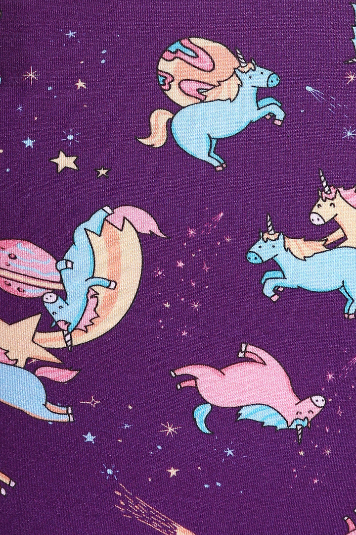 Spaced Out Unicorns pattern on purple shorts set fabric.