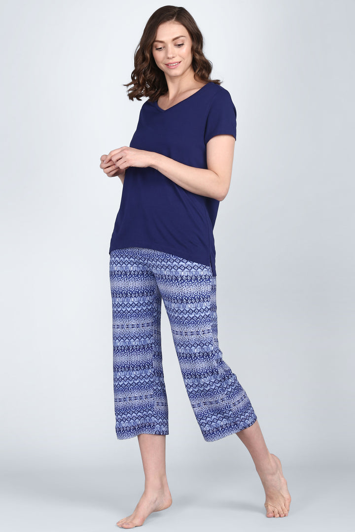 Royal Blue V-Neck Top styled with patterned pants for a casual look.