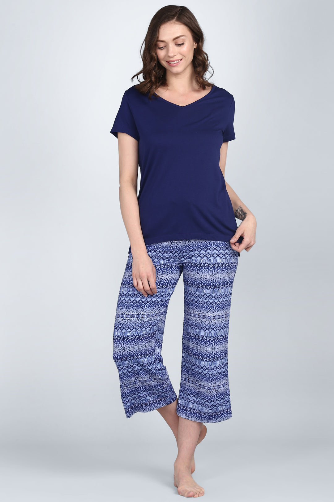 Royal Blue V-Neck Top styled with patterned blue pants.