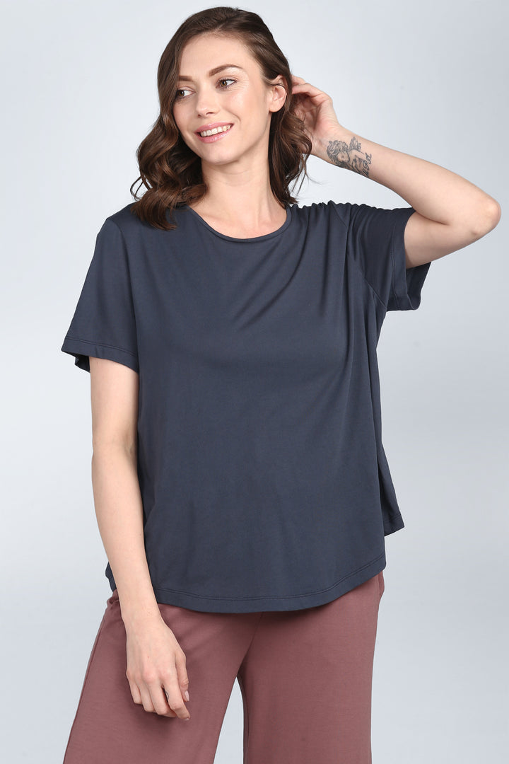 Stylish woman wearing Rose Taupe Lounge Set, relaxed fit outfit.