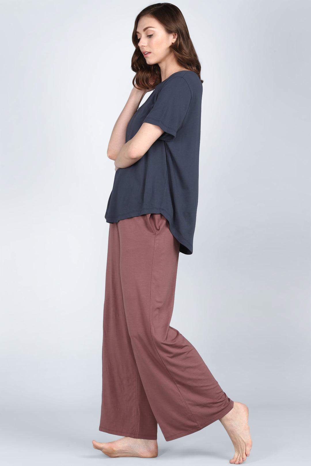 Woman wearing a rose taupe lounge set, stylish and comfortable outfit.