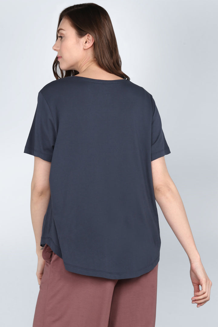 "Model showcasing the Rose Taupe Lounge Set from the back."