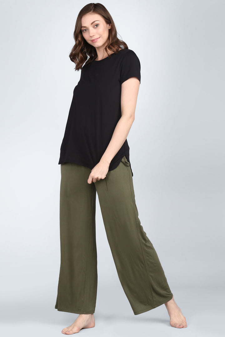 Elegant black lounge set featuring a stylish black top and olive pants.