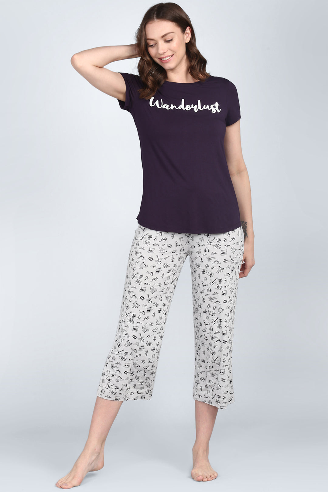 Bon Voyage Capri Set featuring "Wanderlust" graphic tee and patterned pants.