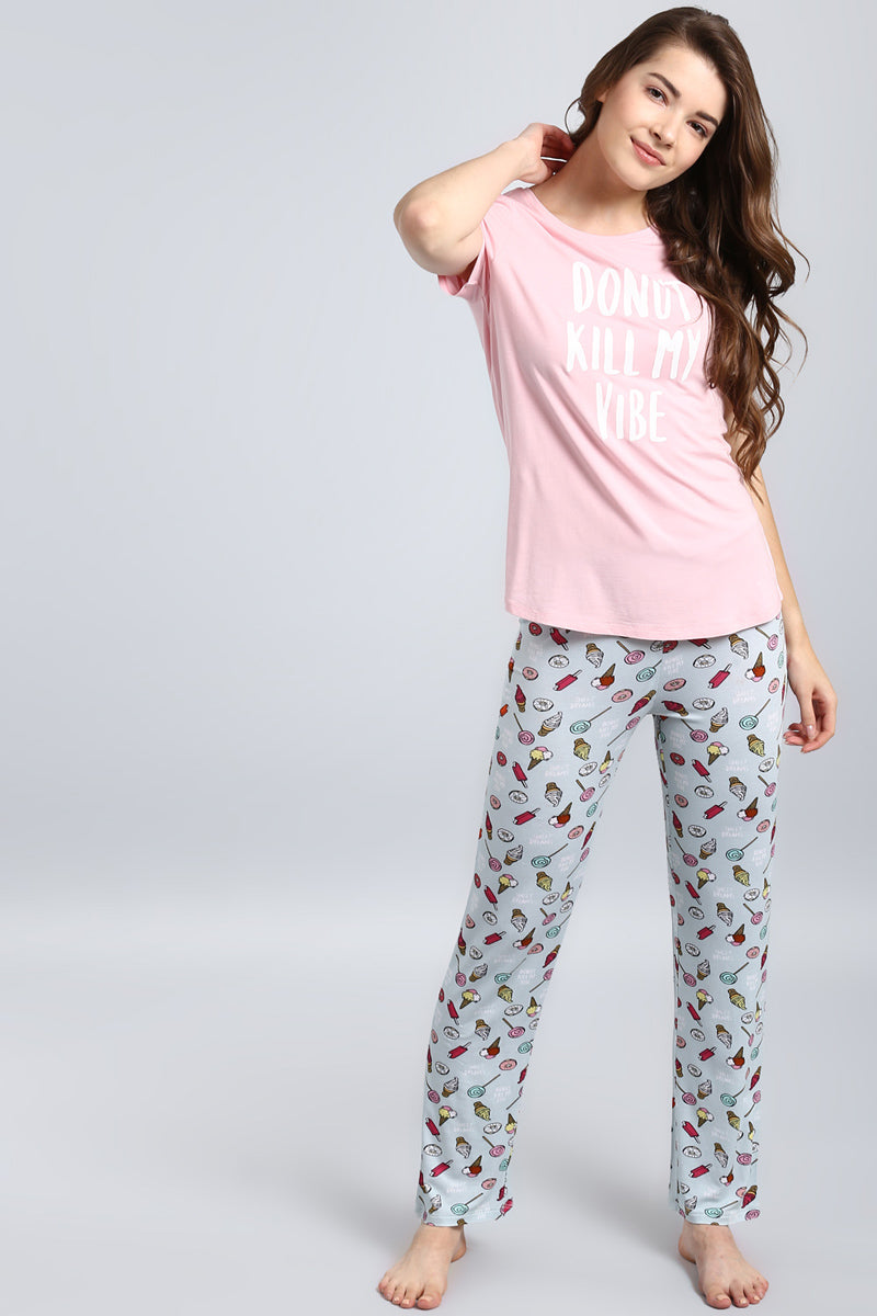 "Model wearing Donut Kill My Vibe Pajama Set in playful design."