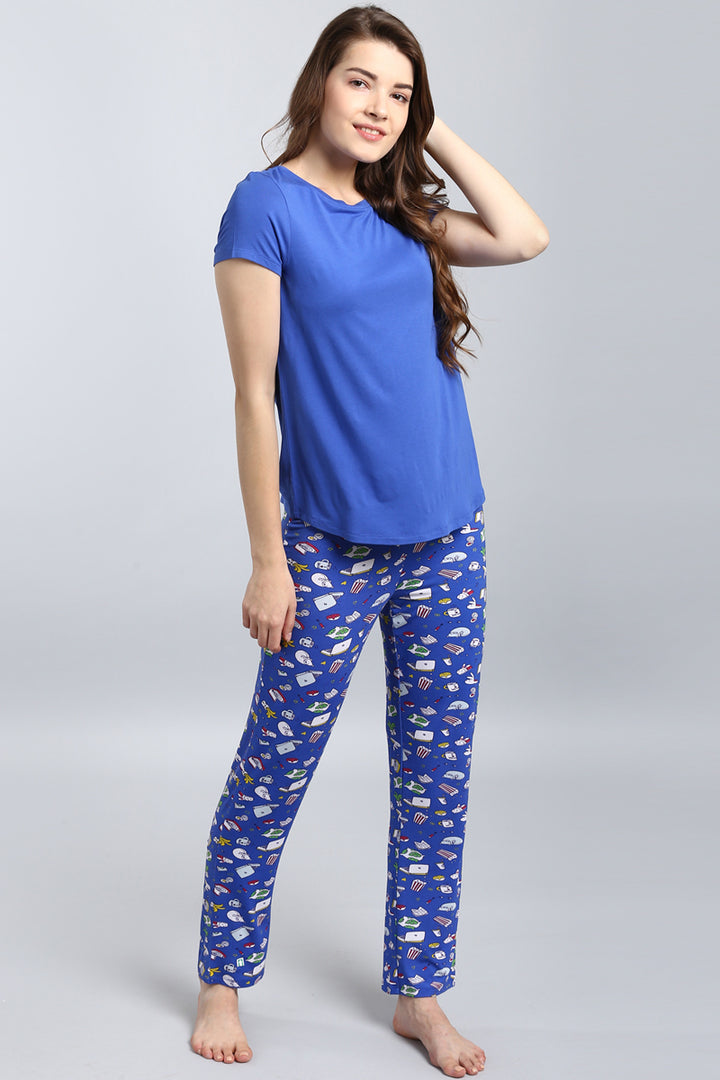 Model wearing Everyday Blue Top with patterned pajama pants.