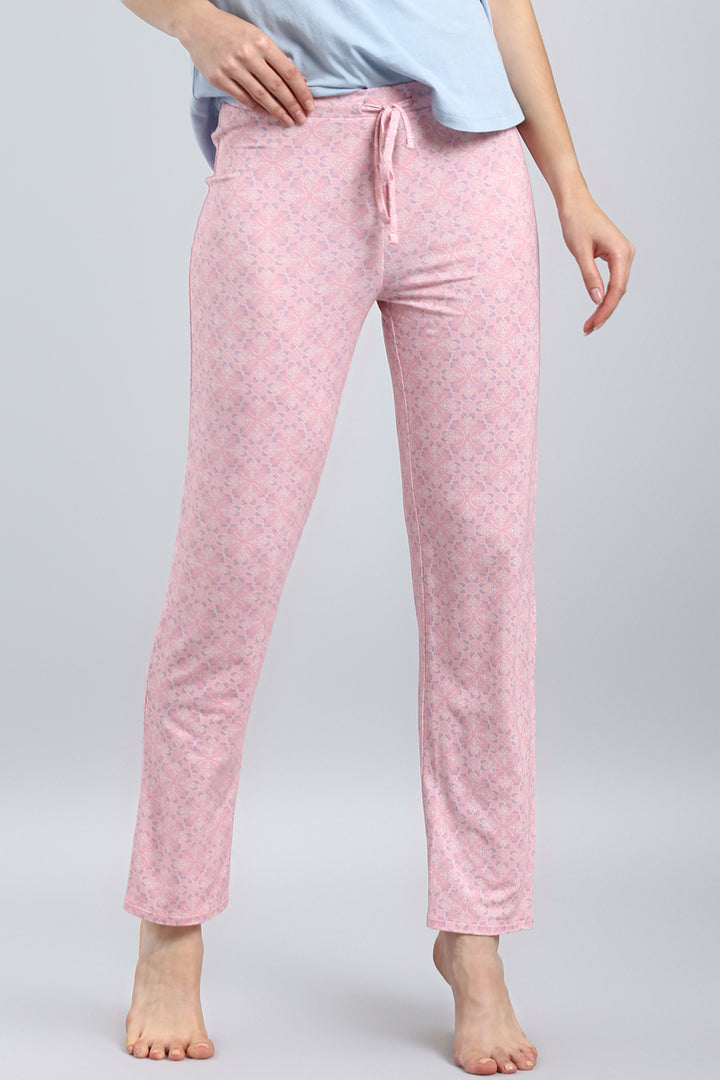 Blush pattern pajama pants displayed on a model.