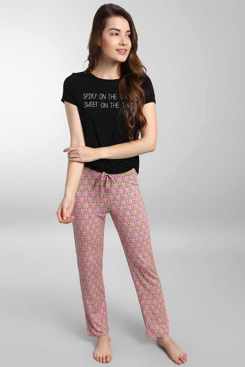Tropical Vacay Pajamas, stylish black top and pink patterned pants.