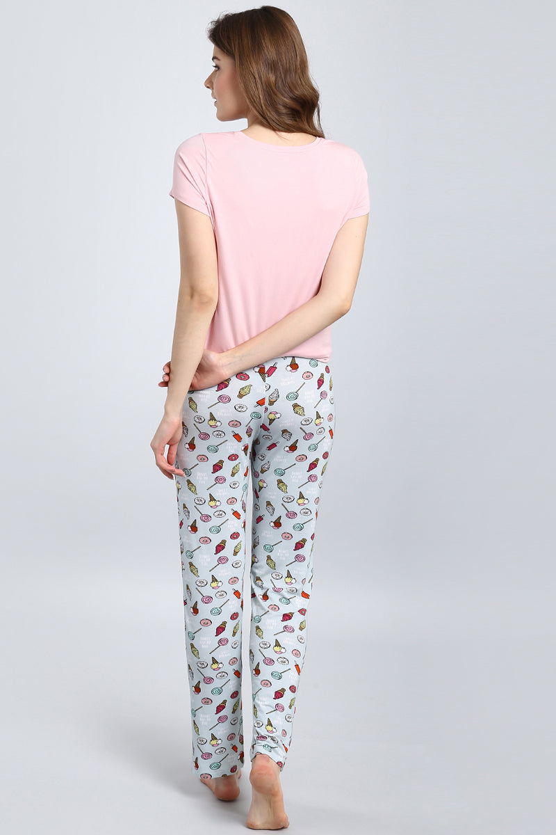Cozy Dreamer Pajamas featuring playful dessert print and soft fabric.