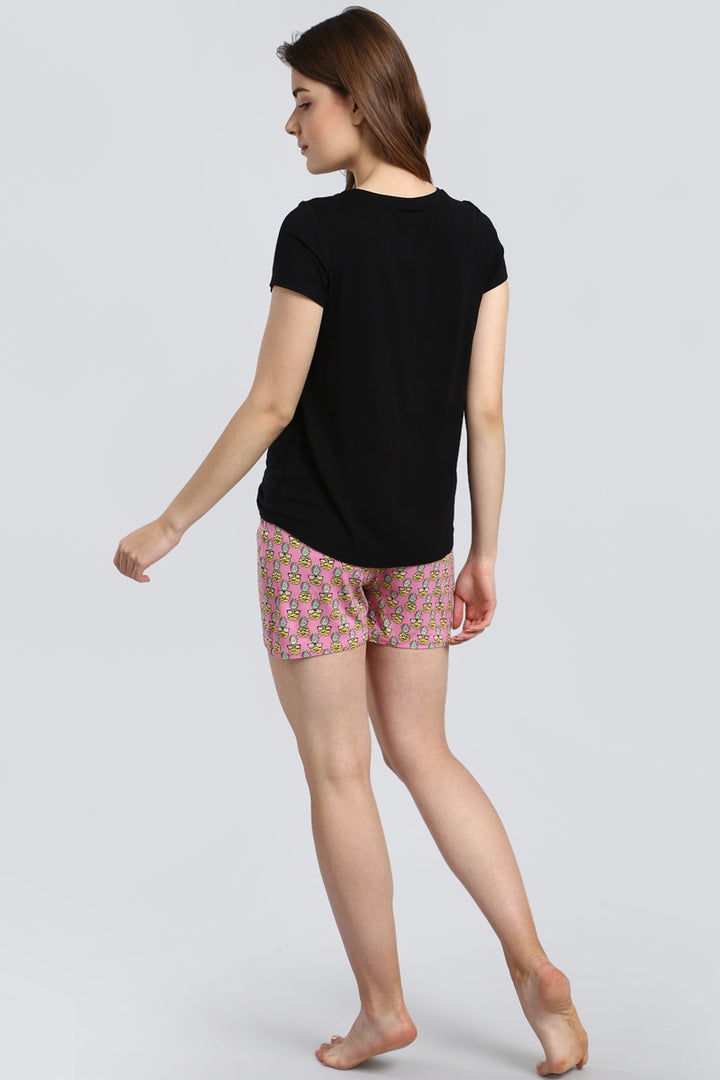 Stylish Tropical Vacay Shorts paired with a black t-shirt.