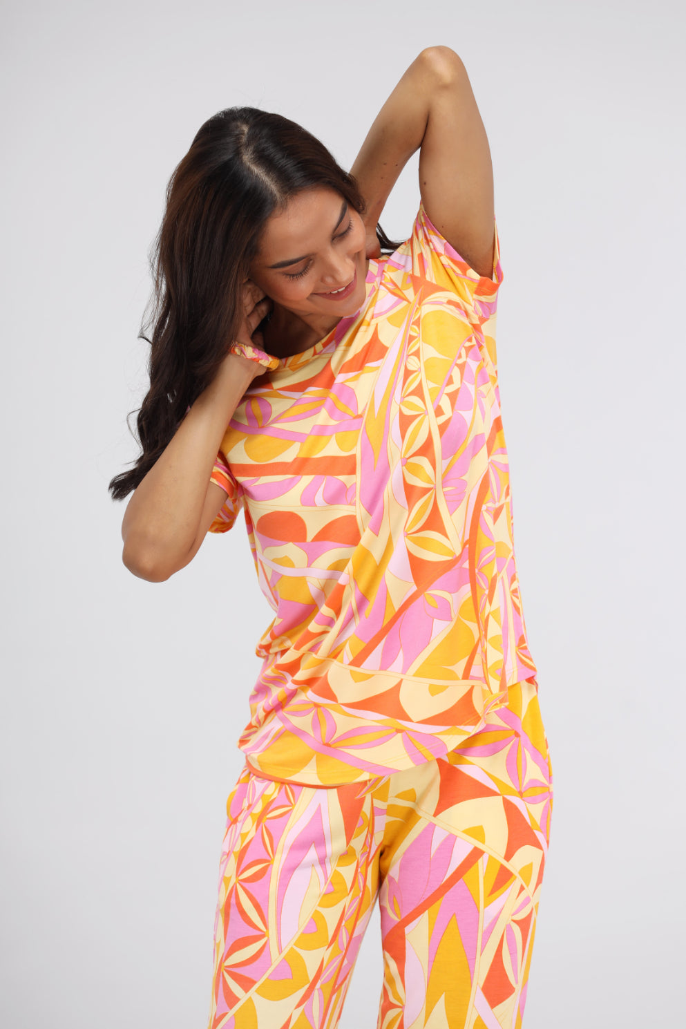 Yellow paisley modal top with colorful patterns and stylish design.
