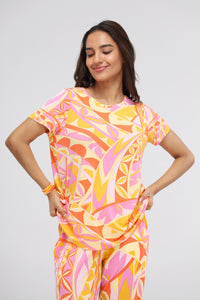 Yellow paisley modal top with colorful geometric patterns and relaxed fit.