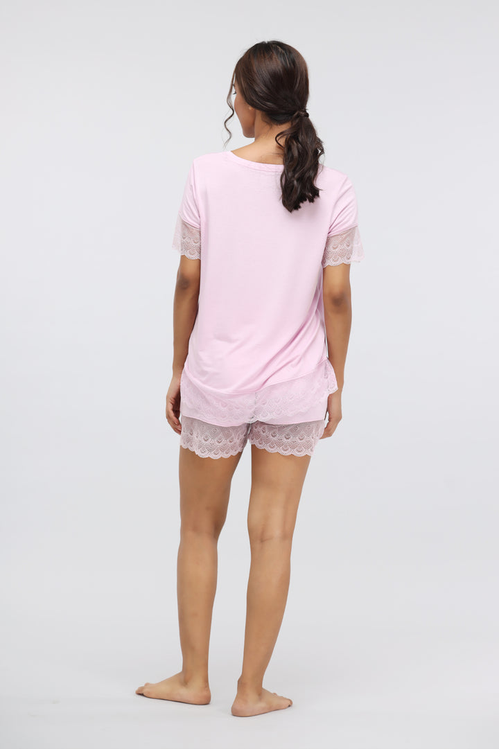 Soft pink lace modal shorts set, back view on model.