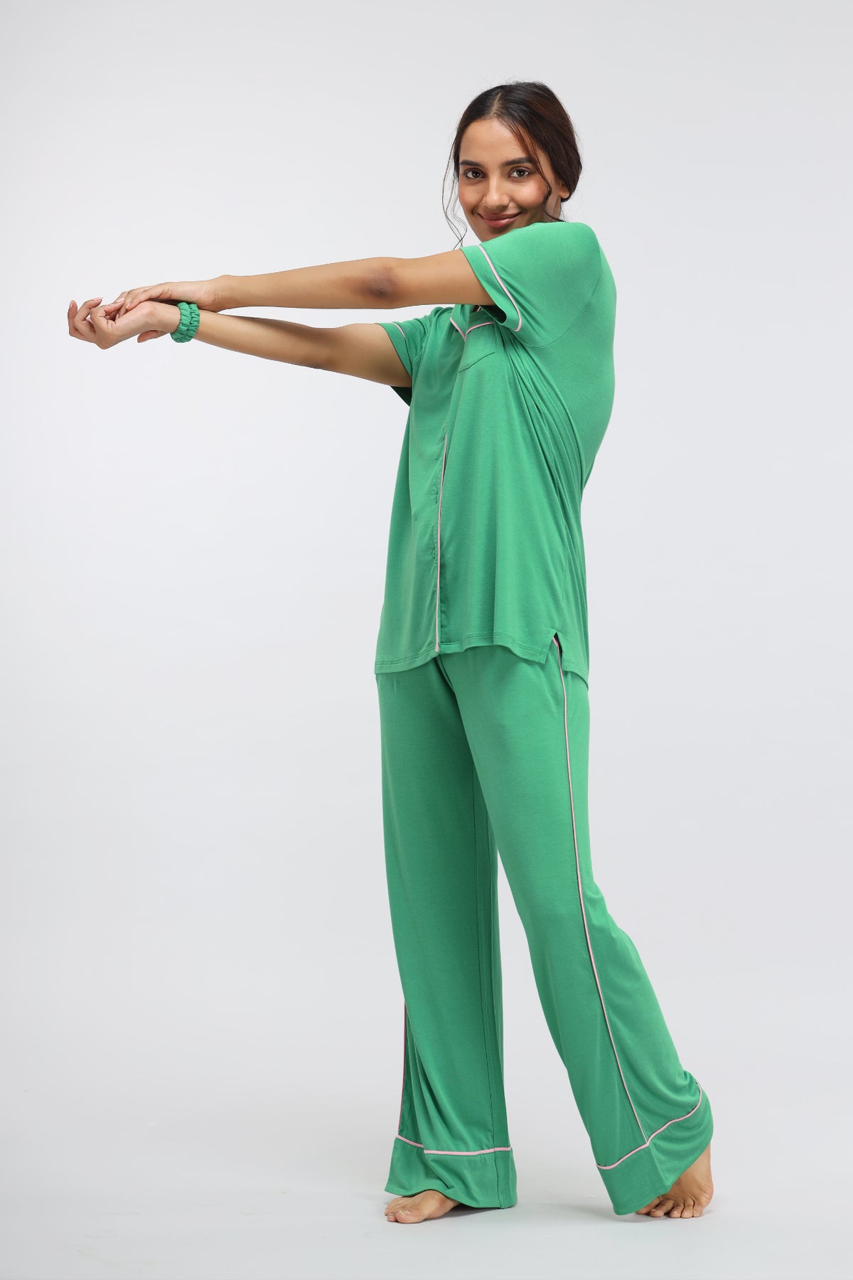 Model wearing Green Bee Modal Piping Half Sleeve Top in green.