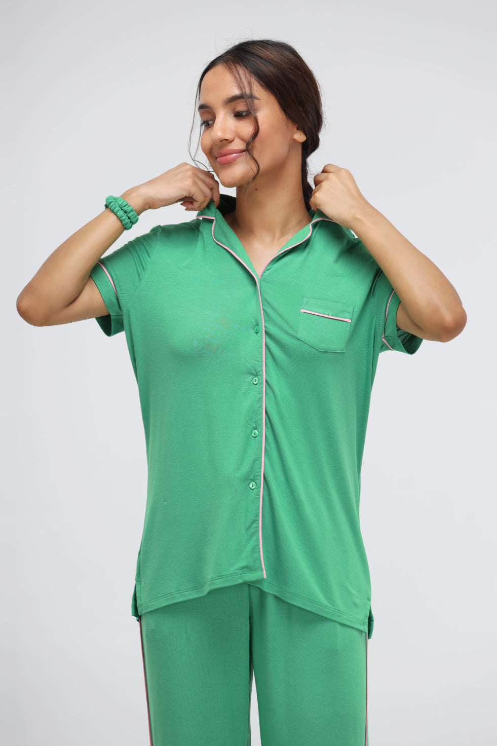 Stylish green modal half sleeve top with piping detail.