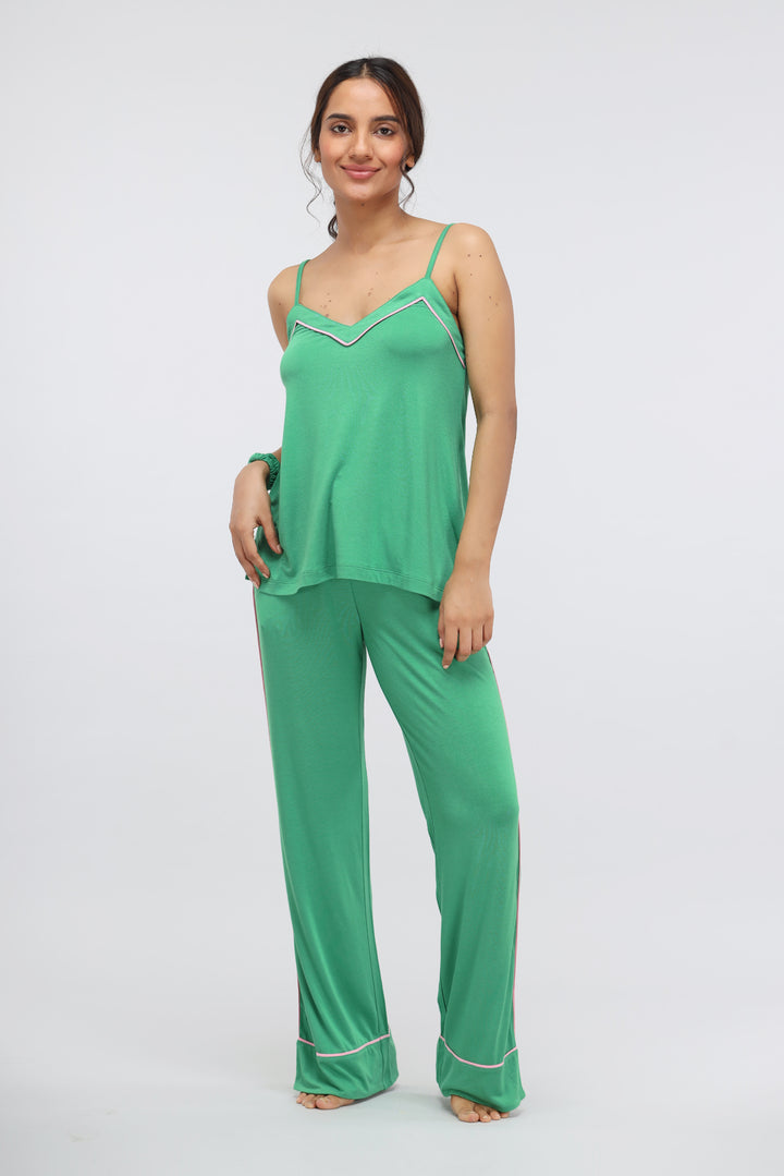 Green Bee Modal Piping Tank Top on model in stylish green outfit.