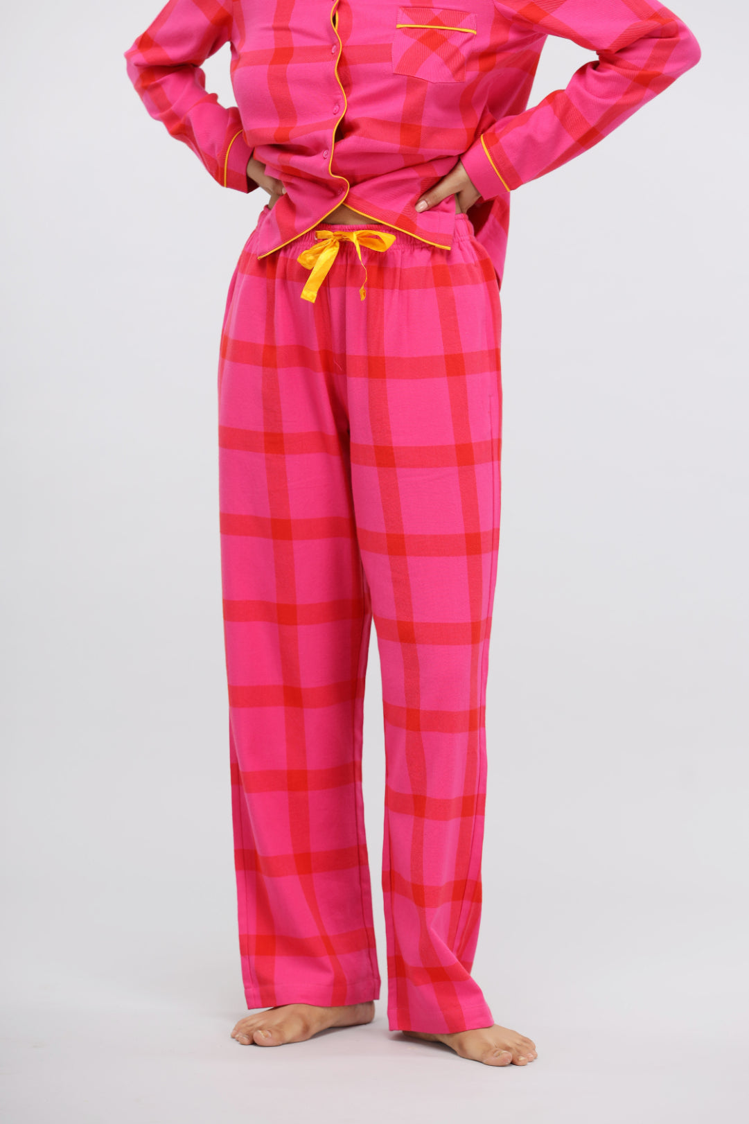 Pink soft cotton plaid pajama set with yellow accents and relaxed fitting.