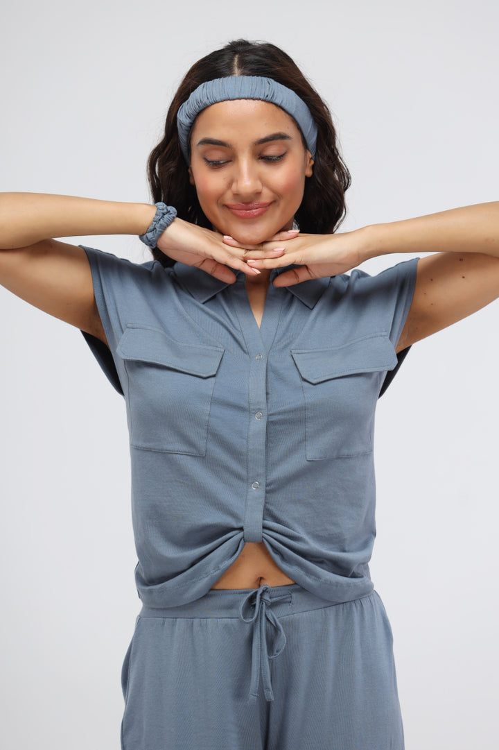 Woman wearing China Blue Supima® Collared Top with playful poses.