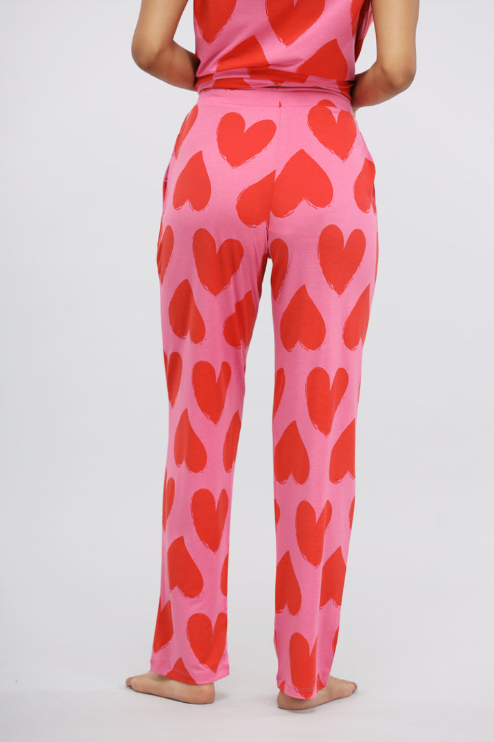 Pink Love Modal Pajama Set featuring playful red heart patterns.