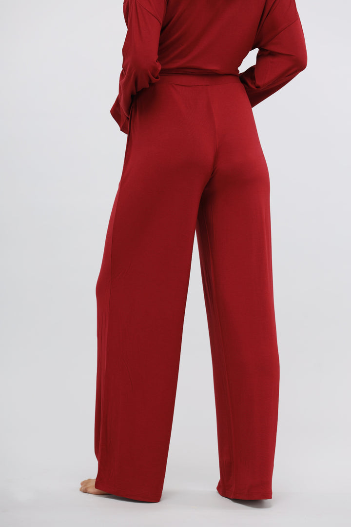 Rhubarb Modal Flared Lounge Pant in rich red, rear view.