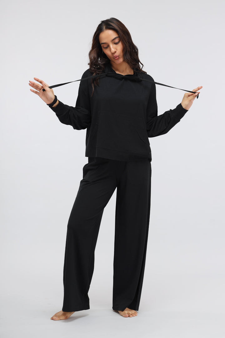 Limited Edition Luxflo Hoodie Set styled in black, model posing elegantly.