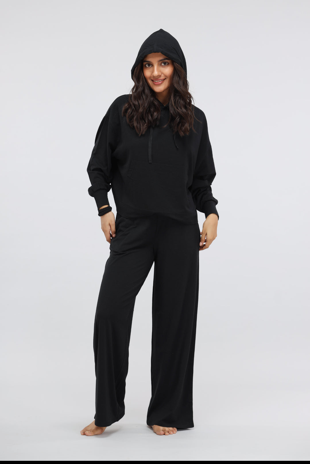 Black Luxflo Travel Hoodie, stylish and comfortable travel apparel for women.
