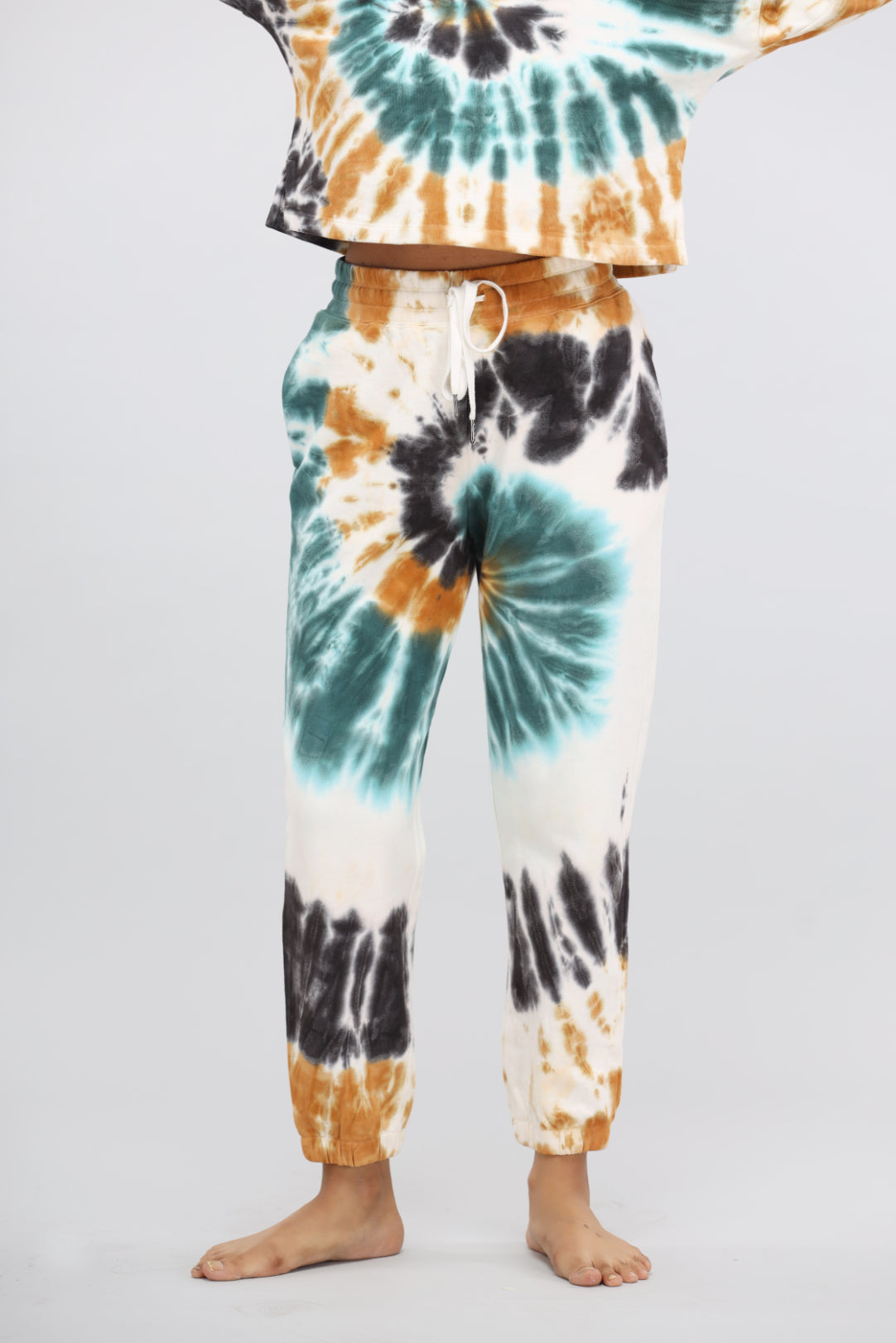 Tie-dye terry travel pants with playful colors, perfect for casual wear.