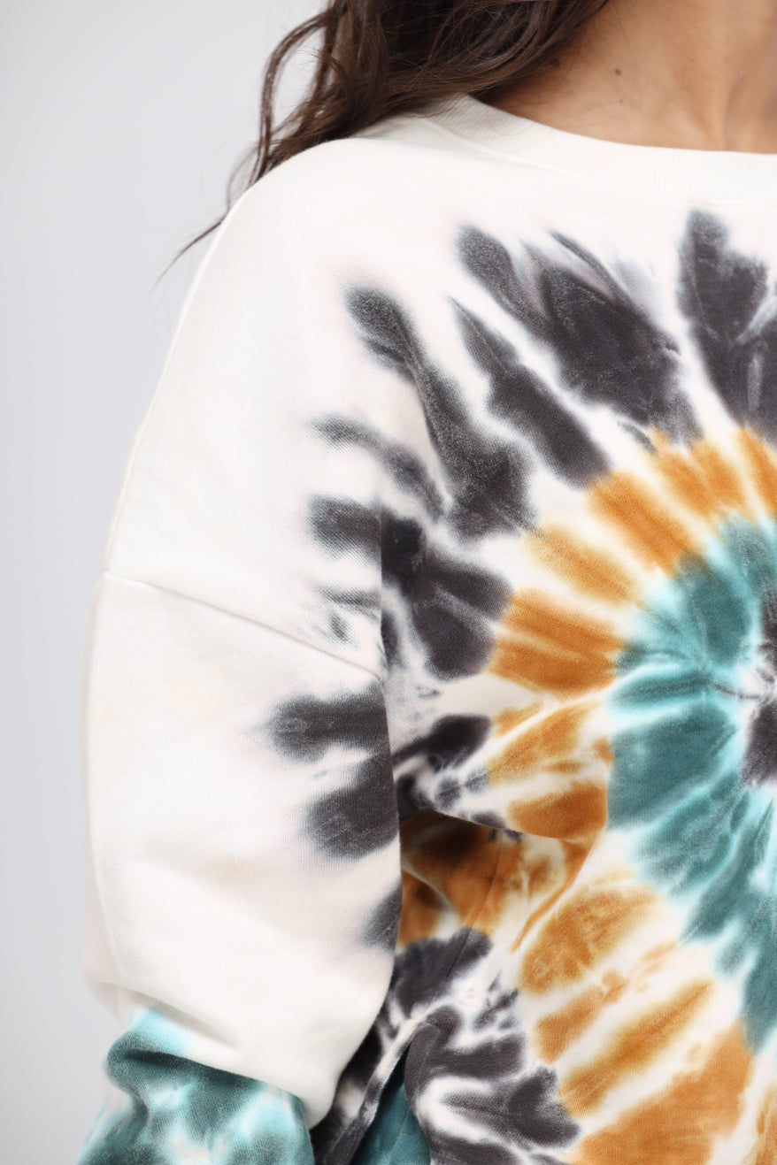 Tie-dye terry sweatshirt with vibrant colors for travel comfort.