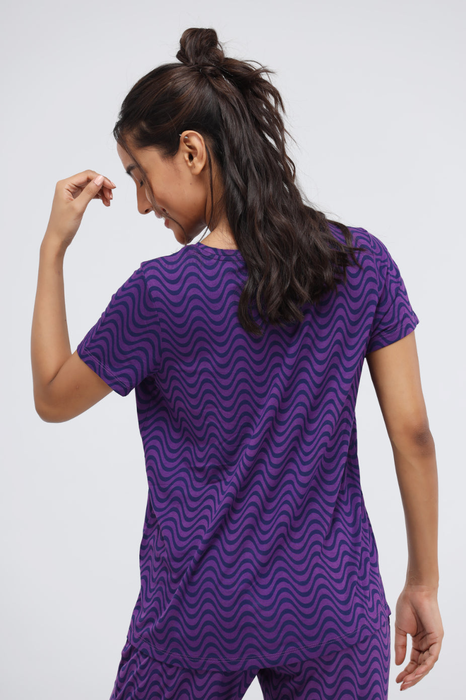 Purple wavy modal printed pajama set model showcasing back view.