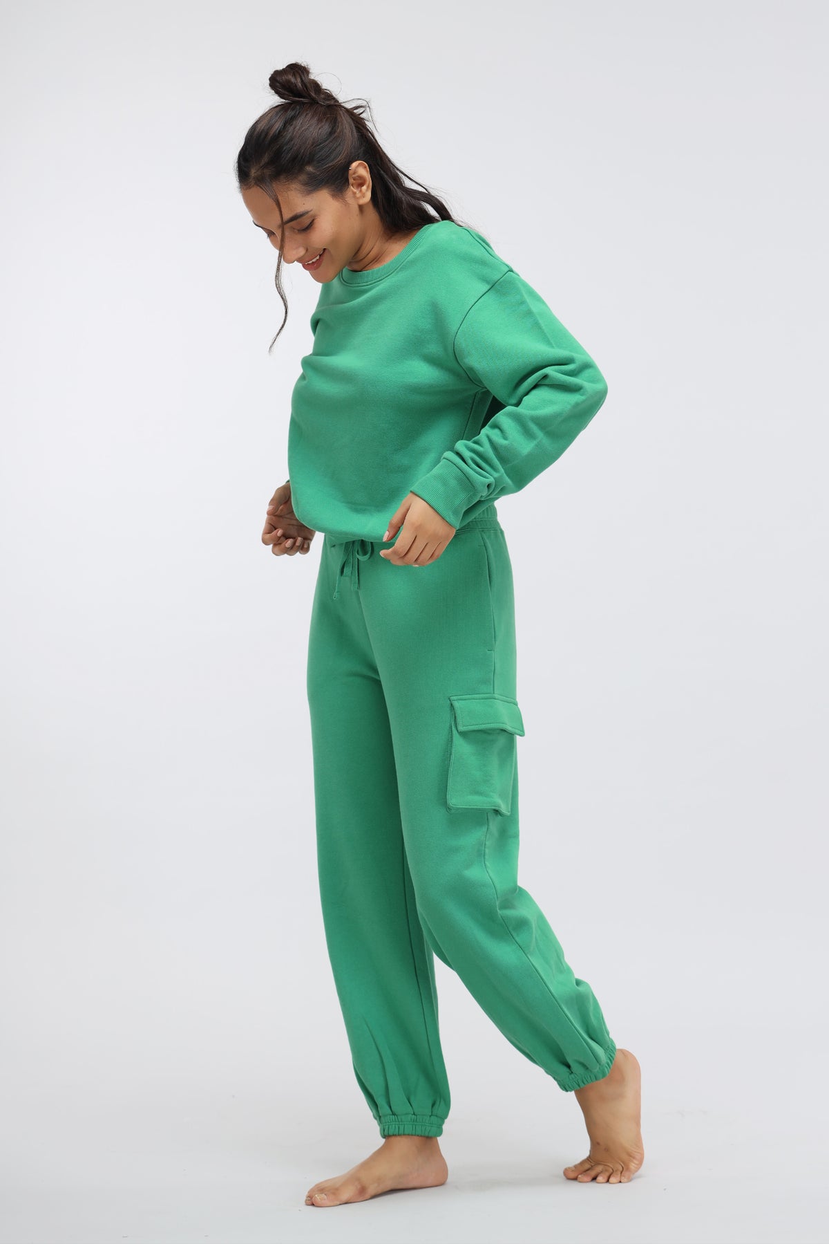 Comfortable green terry sweatshirt and matching pants for relaxed styling.