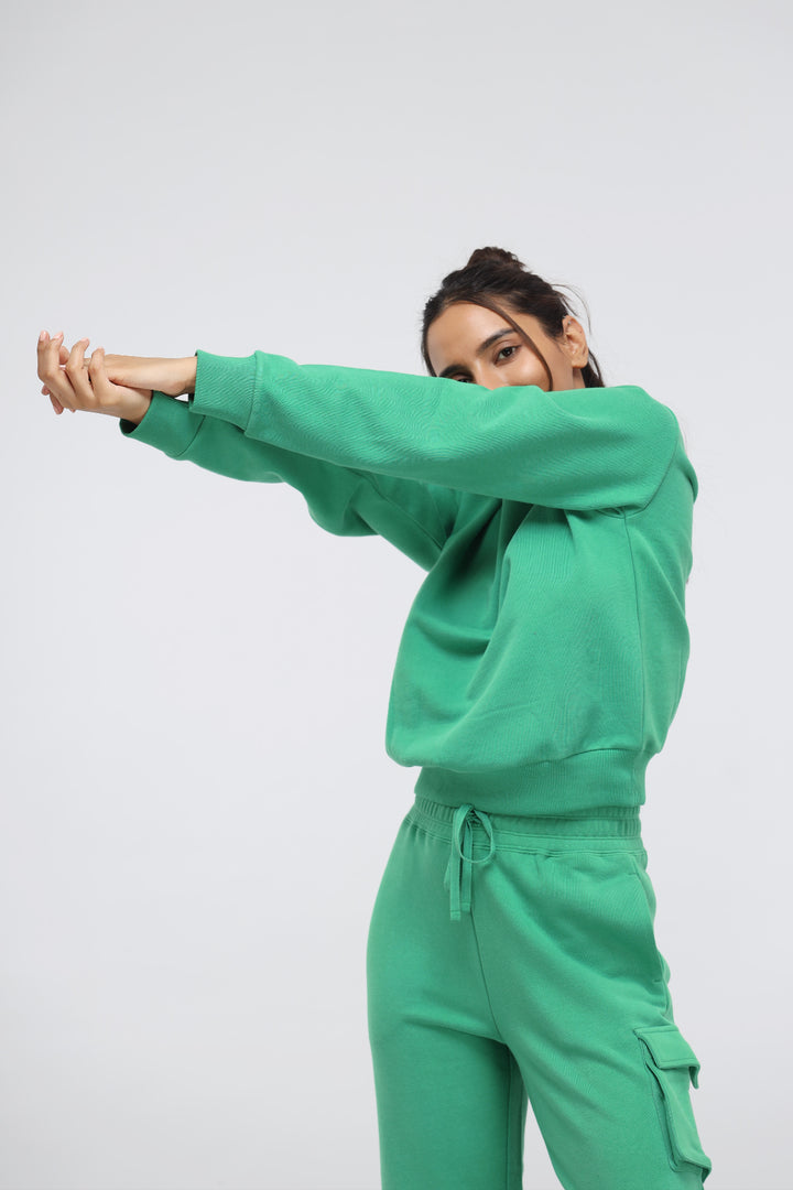 Green Bee Relaxed Terry Sweatshirt showcased in a stylish, casual setting.