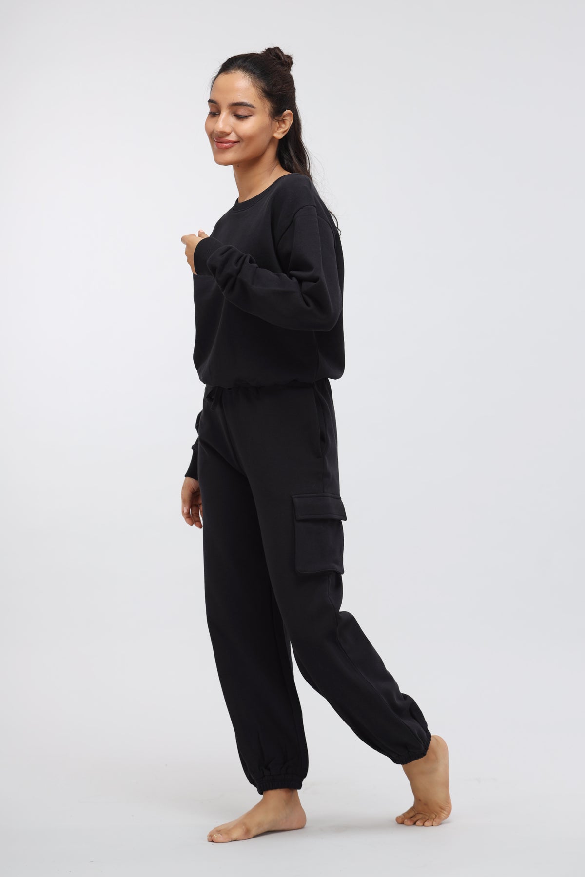 Jet black terry jogger pants with patch pocket, stylish casual wear.