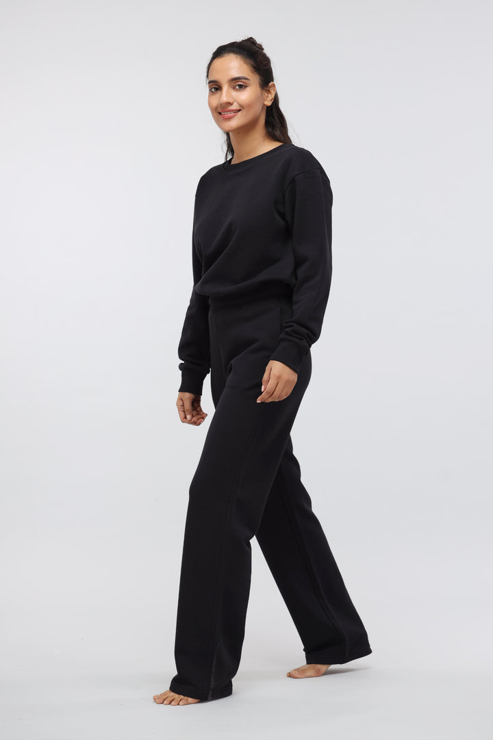 Jet Black Terry Travel Set model walking, stylish loungewear for comfort.