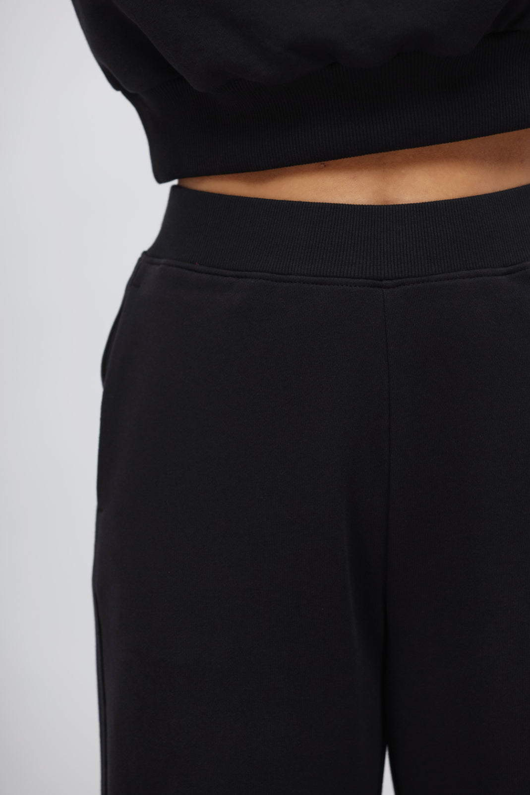 Jet black terry jogger pants with patch pocket detail.